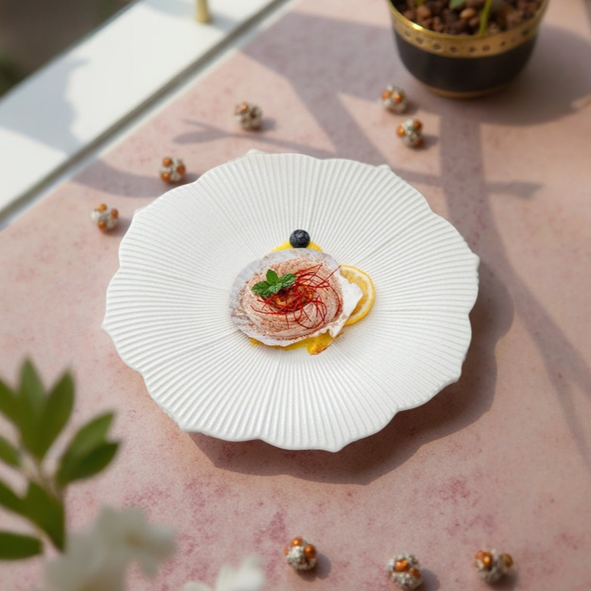 Inspired by nature’s floral beauty, this artisanal plate features a flower-shaped design with fine radial grooves and soft scalloped edges, providing an elevated visual appeal that enhances any culinary creation.