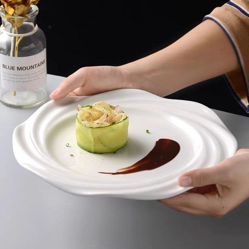 Crafted with artistic precision, the plate features a concentric wave-inspired design that creates a striking visual centerpiece.