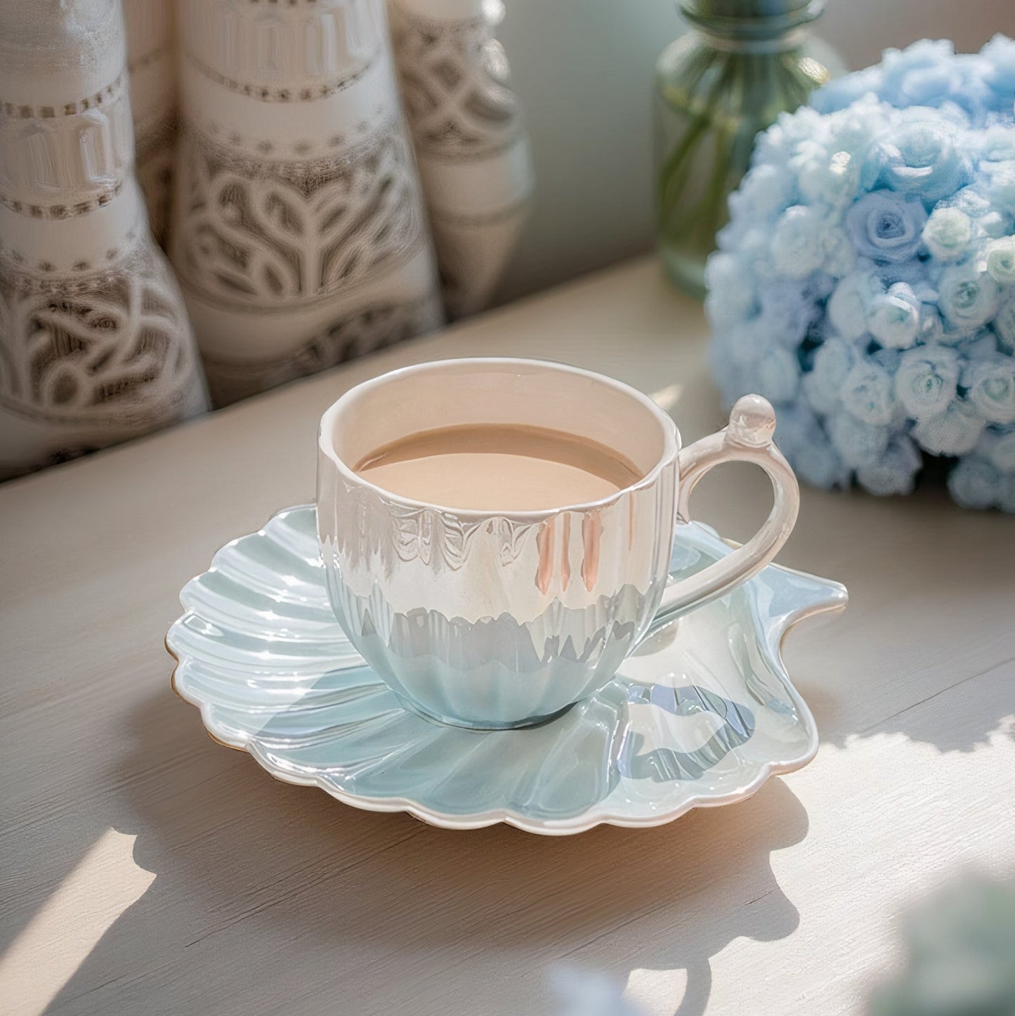 Designed to mimic the graceful curves of a seashell, each piece boasts a delicate iridescent finish that catches the light, evoking the shimmer of ocean pearls. The sculpted handle features a charming pearl-like accent,