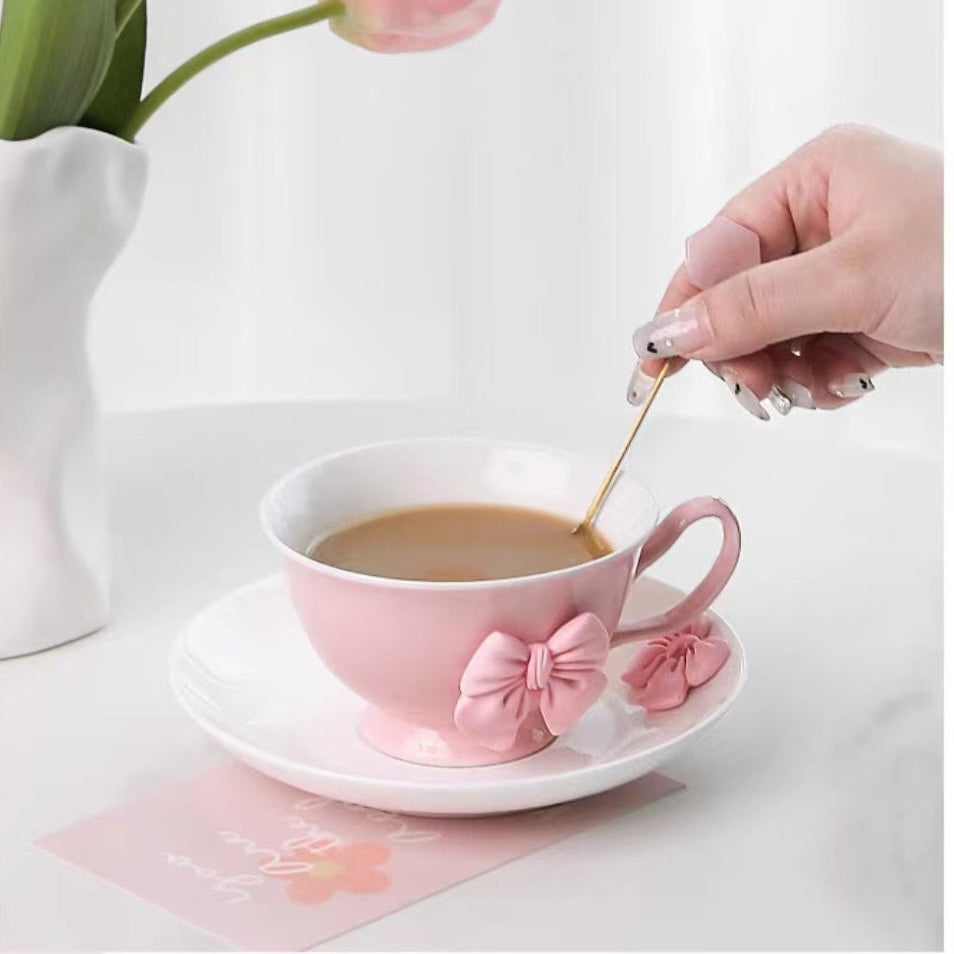 a beautifully feminine drinkware collection adorned with soft pink bow embellishments.