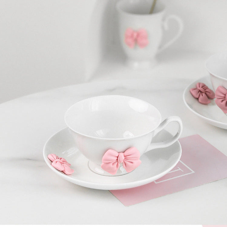 a beautifully feminine drinkware collection adorned with soft pink bow embellishments.