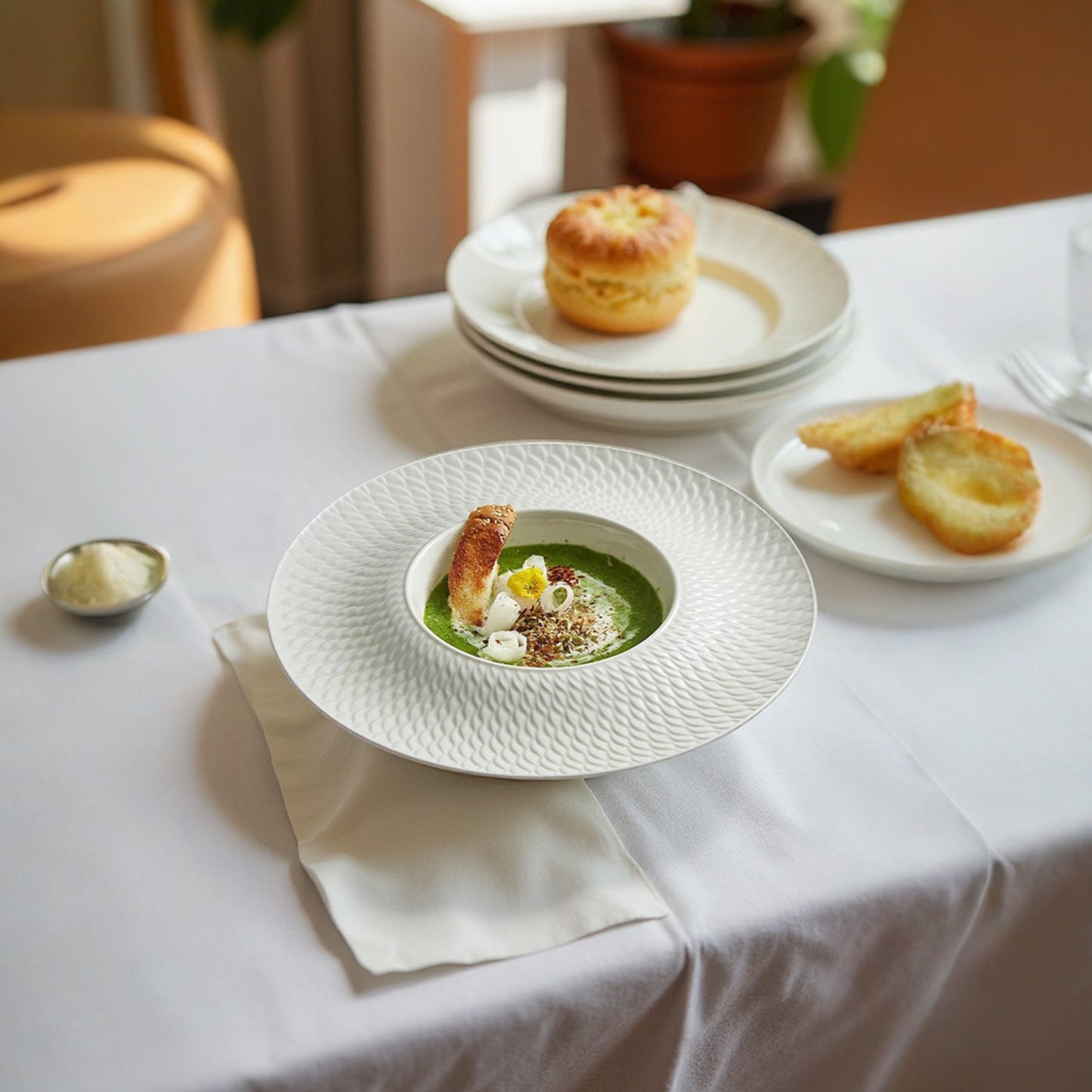A luxury porcelain presentation plate featuring a deep well ideal for soups, purees, or gourmet plated dishes.