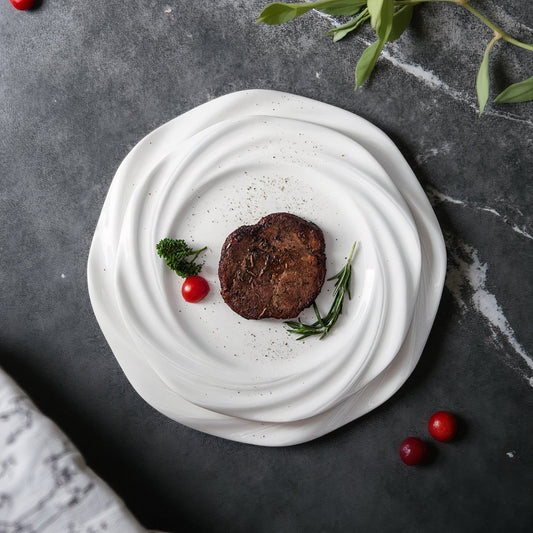 Crafted with artistic precision, the plate features a concentric wave-inspired design that creates a striking visual centerpiece.