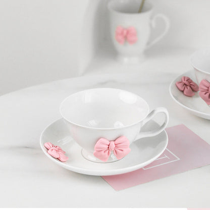 a beautifully feminine drinkware collection adorned with soft pink bow embellishments. 