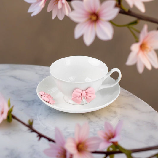 a beautifully feminine drinkware collection adorned with soft pink bow embellishments. 